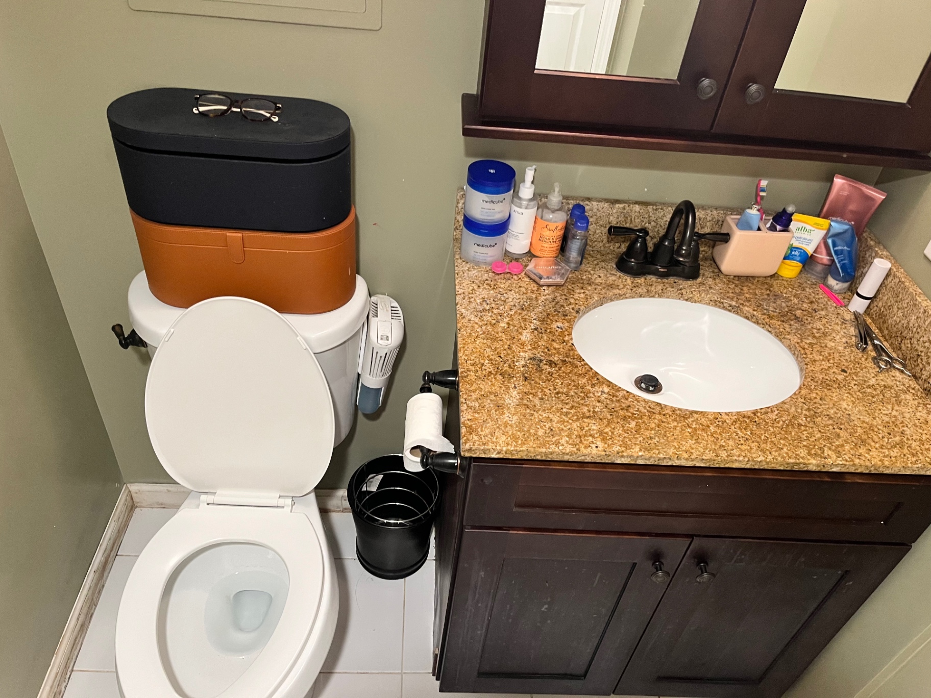 Spotless white sink and cleared granite vanity after a Clean & Shine visit